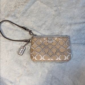 COACH tan and silver wristlet